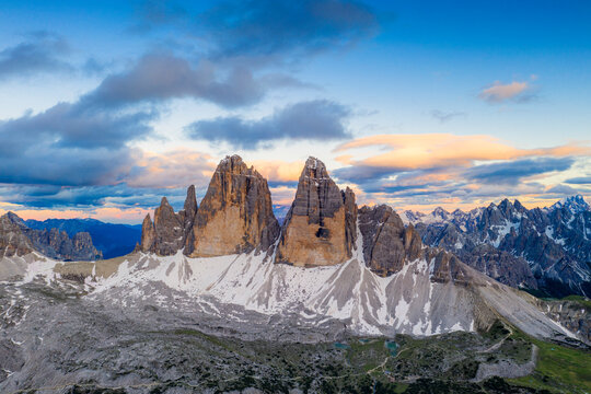 Aerial view of Tre Cime di Lavaredo and Grava Longa lakes at sunset, Sesto Dolomites Natural Park, South Tyrol, Italy
