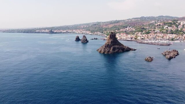 video drone Faraglioni di Acitrezza in the Ionian coast in Sicily Italy