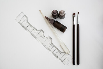 accessories for the master in the design and coloring of eyebrows on a white background