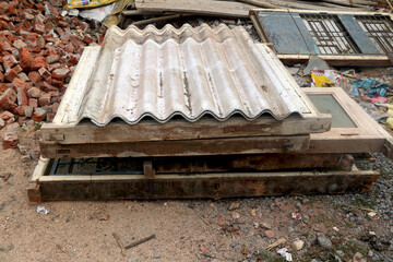 old vintage wooden door and window frame with cement sheet (scrape) on ground