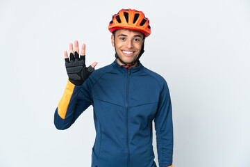 Young cyclist Brazilian man isolated on white background counting five with fingers