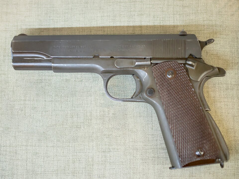 KIEV, UKRAINE-JULY 23, 2019: 1911 semi-automatic pistol M1911 ("Government" or "Colt Government") in the Polytechnic Museum at Ukrainian National Technical University