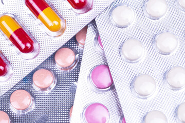 medical pills antiviral drugs blisters packaging closeup, top view