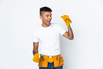 Young Brazilian electrician manipulated isolated on white background celebrating a victory