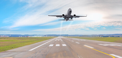 Fototapeta na wymiar White Passenger plane take-off runway from airport 