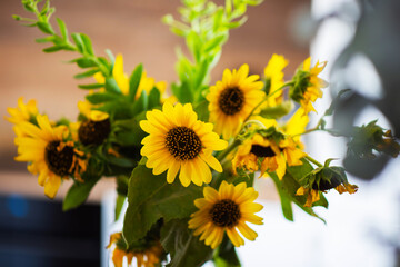 Orange flowers. Vintage autumn photo. Autumn flowers of sunflowers, leaves on rustic vintage background.