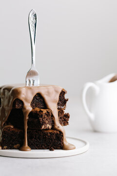 Cake fork speared into chocolate brownie stack