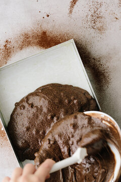 Pouring Brownie Cake Batter Into Baking Tin