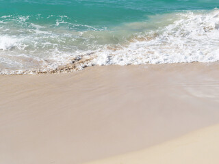 Fototapeta na wymiar Ocean wave and white sand at tropical beach, Dominican Republic.