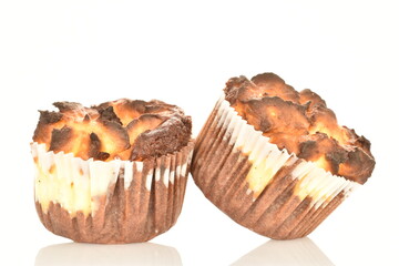 Several fragrant chocolate curd muffins, close-up, isolated on white.