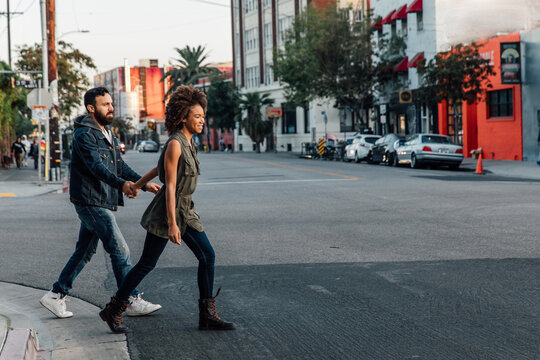 Couple Cross Street Together.