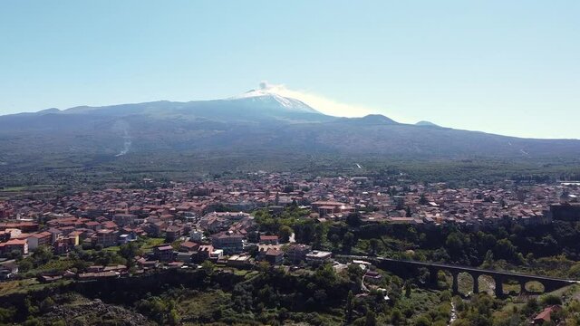 video with drone view of Randazzo with the Etna volcano in the background in Sicily Italy
