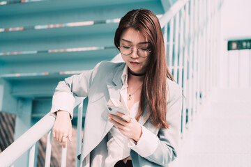 fashion business Asian woman using a cell phone