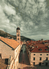 View of the famous Stradun street in the old town of Dubrovnik, as seen from above while climbing the city walls. Long narrow street surrounded by old houses