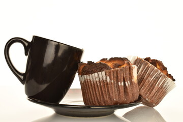 Several fragrant chocolate curd muffins, close-up, isolated on white.