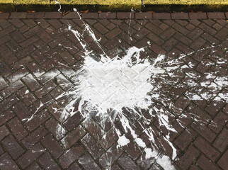 blotch of white paint on street