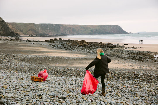 Clearing Rubbish Of A UK Beach