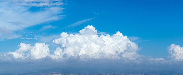 Panoramic view of panoramic blue sky with big cumulonimbus. High resolution stitched panorama.