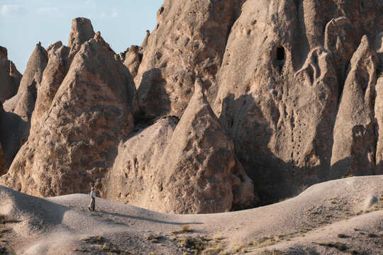 Female Traveller Walks Around Sandstone Rocks