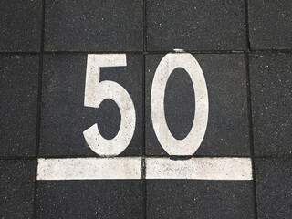 sidewalk tiles with number 50 on it
