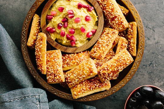 Cheese Bites with houmous dip with pomegranate seeds