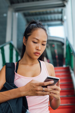 Sportswoman Typing on her Phone