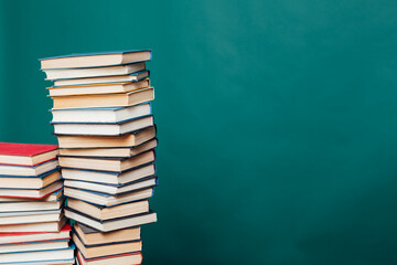 many stacks of educational books to study in the university library as a background