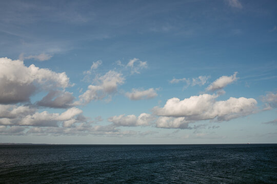 Cloudy sky over rippling sea