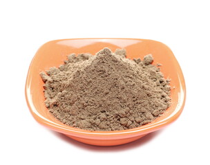 Organic linseed protein powder pile in bowl isolated on white background