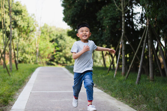 little asian boy running