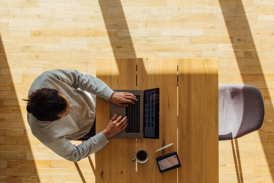 Man working on laptop from home