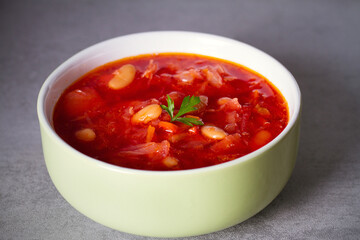 Beetroot soup made with vegetables beans and meat: borsht, bortsch, borshch, borscht