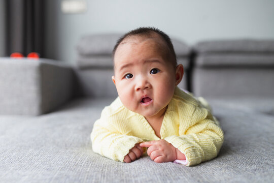 portrait of little asian baby at home