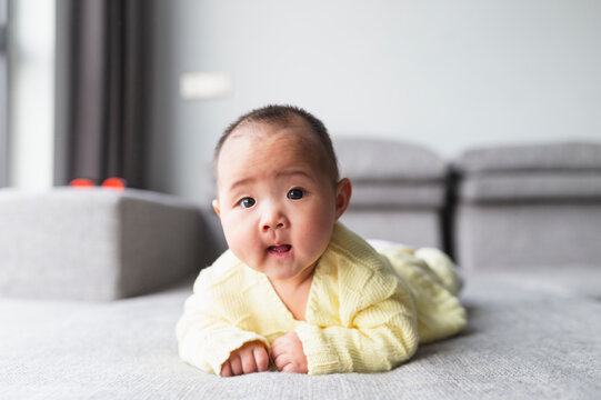 portrait of little asian baby at home