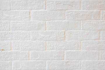 Abstract weathered textured white brick wall background. Brickwork stonework interior, rock old clean concrete grid uneven, horizontal architecture wallpaper.