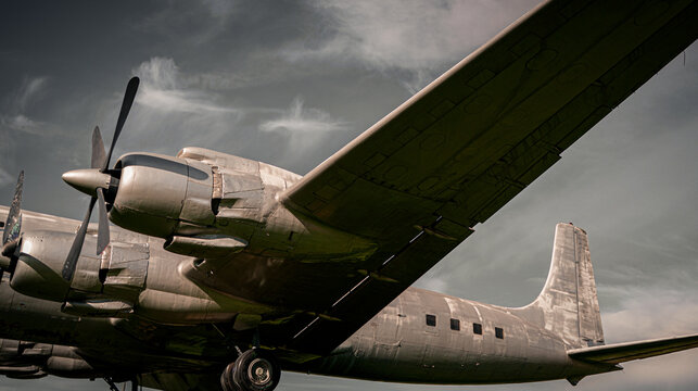 Old propeller airplane, vintage sepia black and white tone, against the sky background. Propeller and turbine detail