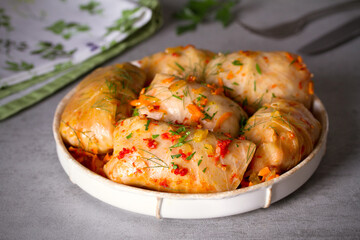Cabbage rolls with meat, rice and vegetables. Chou farci, dolma, sarma, golubtsi or golabki