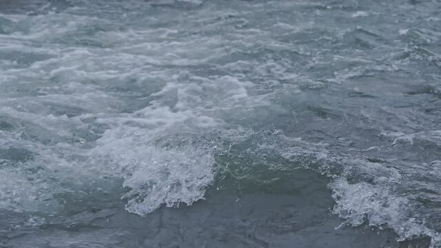 Close up view of sea wave with foam on coast in Catalonia