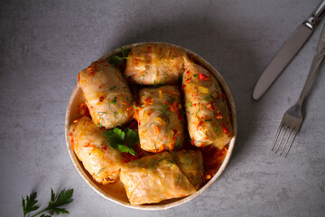 Cabbage rolls with meat, rice and vegetables. Chou farci, dolma, sarma, golubtsi or golabki. Flat lay, layout, overhead