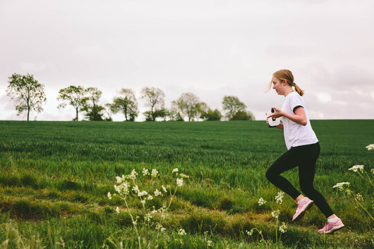 Young teenager running in the countryside