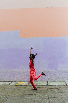 Girl dancing around in street