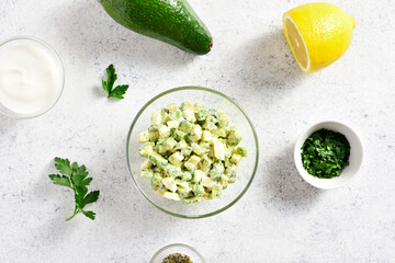 Avocado eggs salad in bowl