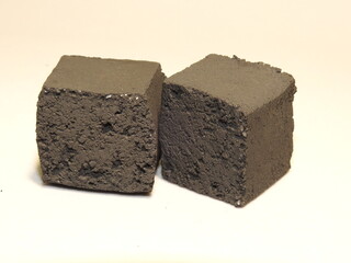 Black charcoal for hookah in cubes located on a dark background