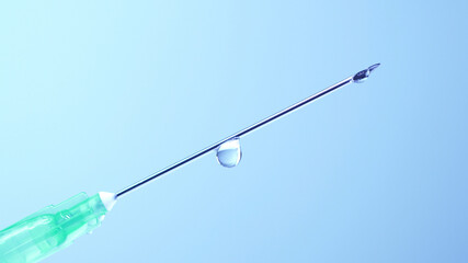 Vaccine dripping from sterile needle syringe. Concept of medical research development and production of vaccine against coronavirus, COVID 19. Drugs and medications for pharmaceutical industry.