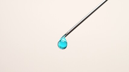 Vaccine dripping from sterile needle syringe macro close up. Administrating medication with medical needle syringe and vaccine injection for patient vaccination in medical hospital.  Health concepts.