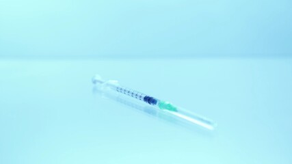 Obraz premium Vaccine taken with medical syringe needle. Vaccination treatment from Covid-19 coronavirus flu strain virus. Virologist researcher scientist development and test. Vaccination of patient.