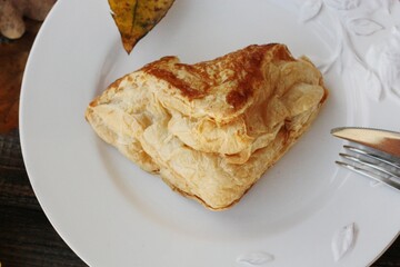 Delicious pastry croissant in a white plate 