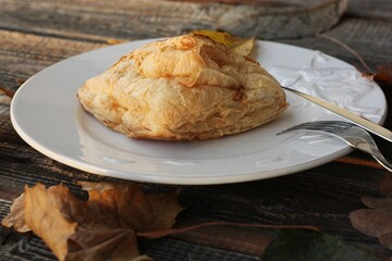 Delicious pastry croissant in a white plate 