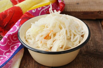 Sauerkraut with carrots on the table macro 