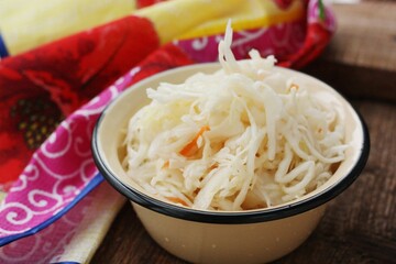 Sauerkraut with carrots on the table macro 